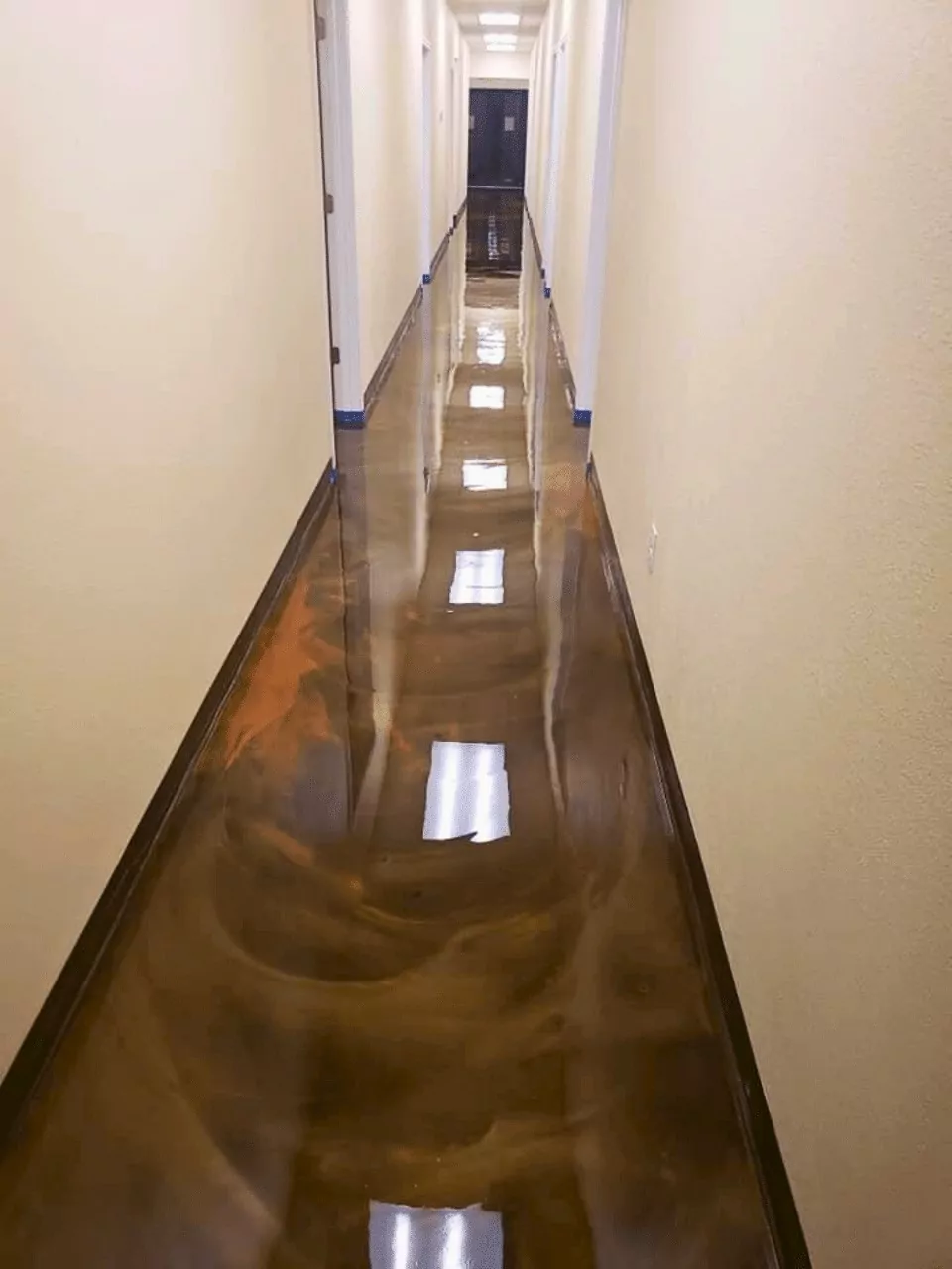 Brown, metallic epoxy, commercial floor coating, office hallway by Decorative Concrete of Texas - Commercial Floor Coatings Project