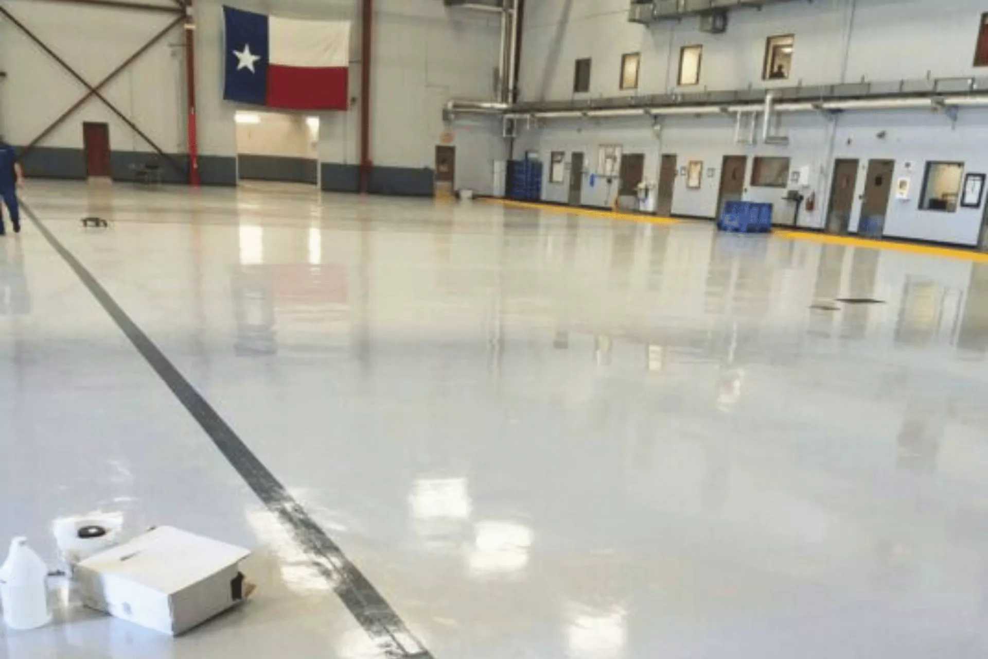 texas commercial floor coating by decorative concrete of texas airplane hanger